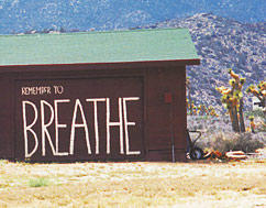 a picture of a barn with 'remember to breathe' written on it