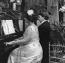 a man and woman playing a duet